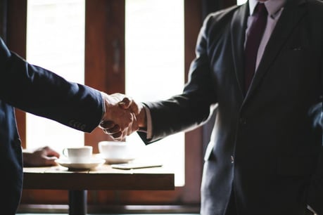 Two business people shaking hands