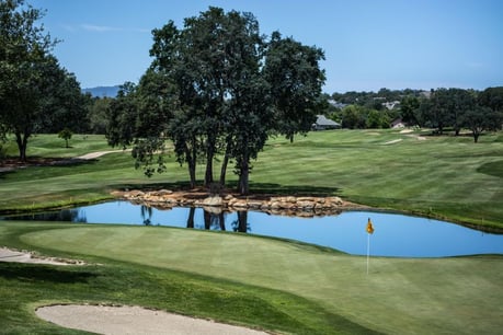 Golf course with water and trees